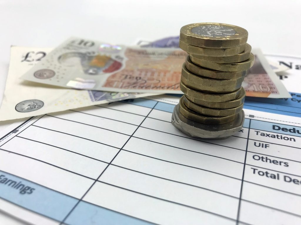 Payslip with notes & coins