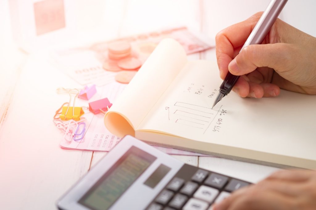 Paper Accounts with calculator & pen