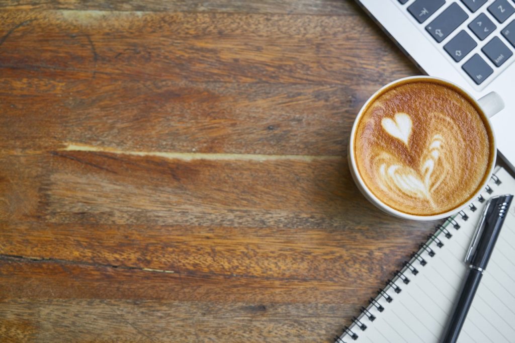 Coffee with MacBook and Notepad